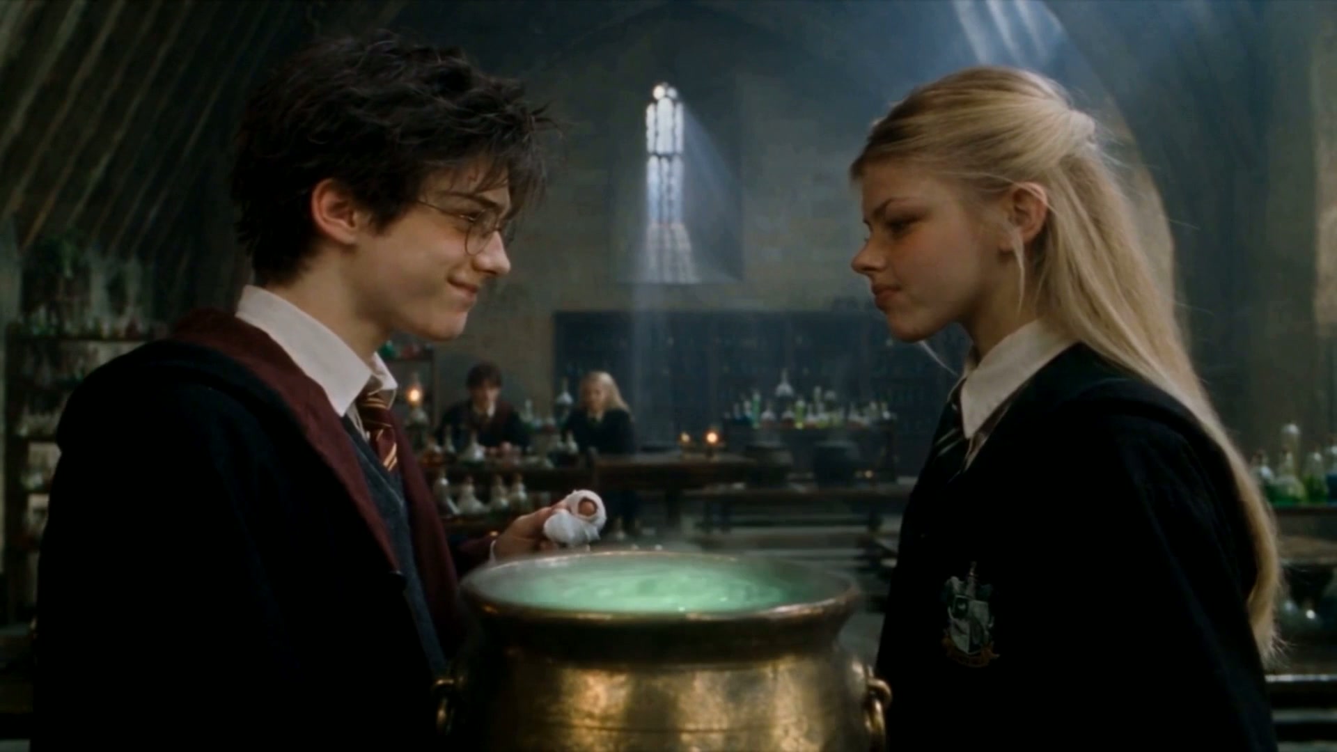 The cauldron glows green as the lesson ends