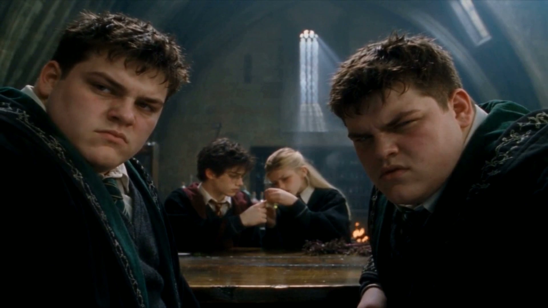 Crabbe and Goyle keep watch from the next bench