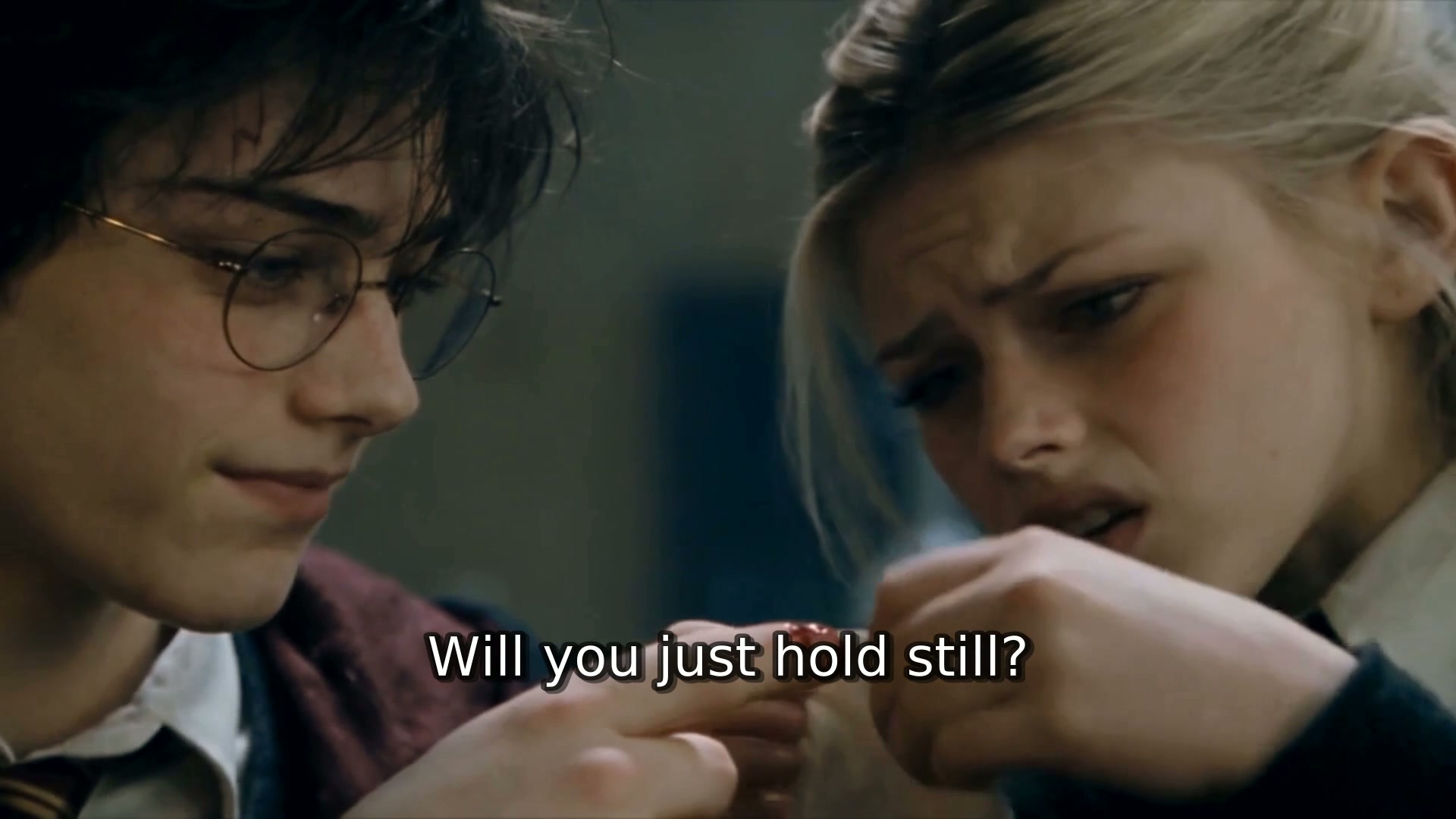 "Will you just hold still?" Draconia tends Harry's cut